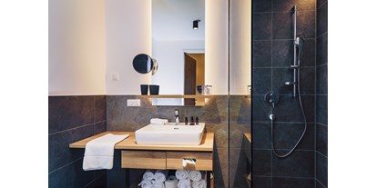 Mountainbike Urlaub - Leogang - Bathroom - Stockinggut by AvenidA | Hotel & Residences