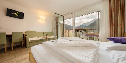 Mountainbike Urlaub - organisierter Transport zu Touren - Trentino-Südtirol - Panoramazimmer Almenrausch - Niggl easygoing Mounthotel