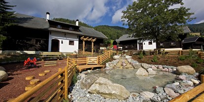 Mountainbike Urlaub - Hotel-Schwerpunkt: Mountainbike & Wandern - Kärnten - Außenansicht Dorf Kleinwild - Slow Travel Resort Kirchleitn