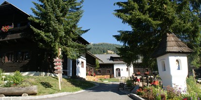Mountainbike Urlaub - Garten - Kärnten - Dorfplatz Dorf Kleinwild - Slow Travel Resort Kirchleitn