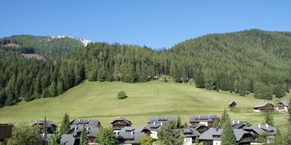 Mountainbike Urlaub - Sauna - Kärnten - Dorfansicht Dorf Kleinwild**** - Slow Travel Resort Kirchleitn