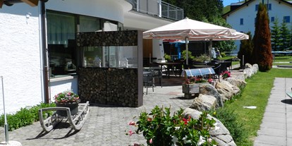 Mountainbike Urlaub - veganes Essen - Schweiz - Zugang Garten Terrasse Minigolf - BIKE Hotel Pizzeria Mittenwald Flumserberg T'heim