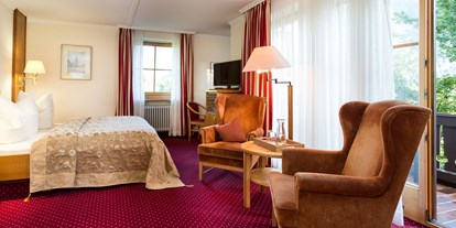 Mountainbike Urlaub - Sauna - Oberbayern - Gemütliches Doppelzimmer mit Terrasse in der Kategorie "Deluxe" - Hotel Der Alpenhof