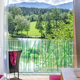 Mountainbikehotel: Balkon des Doppelzimmers Seeblick mit traumhafter Aussicht - Ritzenhof 4*s Hotel und Spa am See